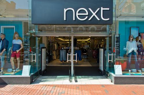 Next nudges up profit outlook but takes extra costs from Middle East